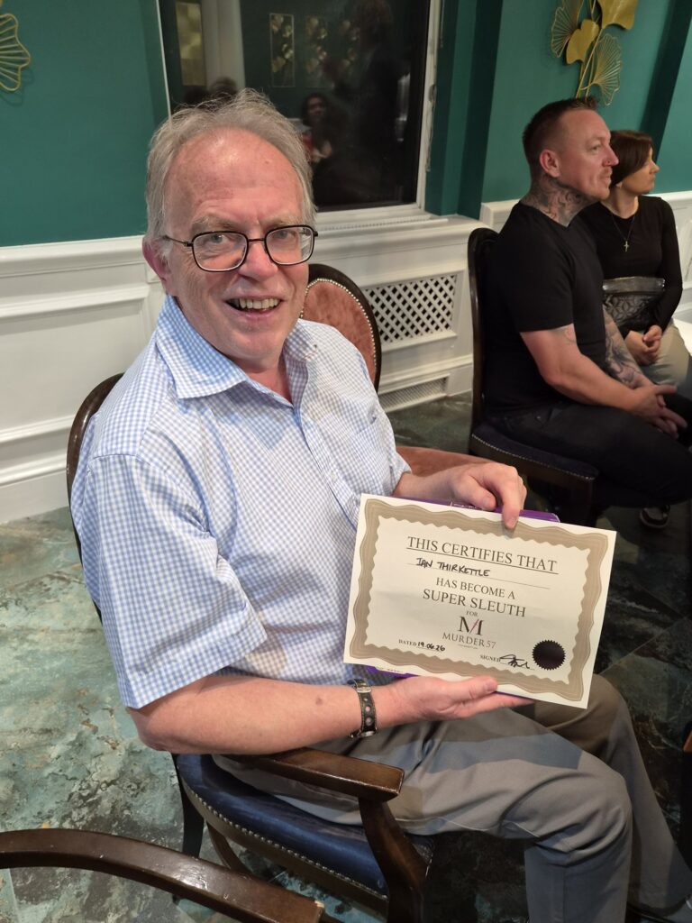 man holding winners certificate